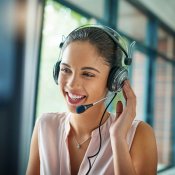 A woman using a headset to make a call